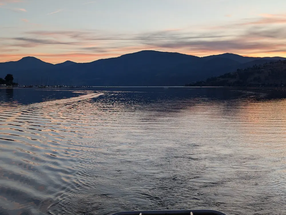 Sunset light on the ripples of Okanagan Lake below the hills, September 17, 2024, 7:11 p.m.