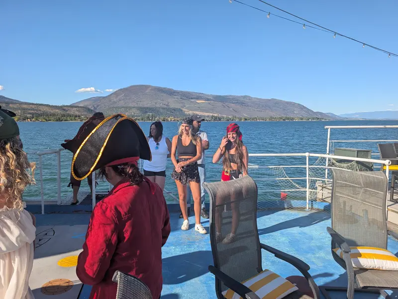 Pirate party guests on the deck of the MV Okanagan tug on Okanagan Lake